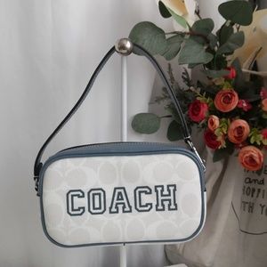 Slightly used Coach Jamie Wristlet In Signature Canvas With Varsity Motif Chalk
